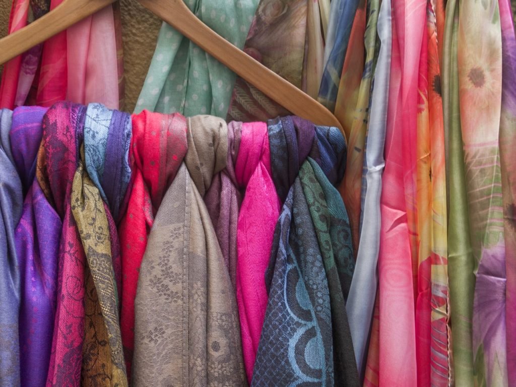 DepositPhoto of colorful hanging scarves.